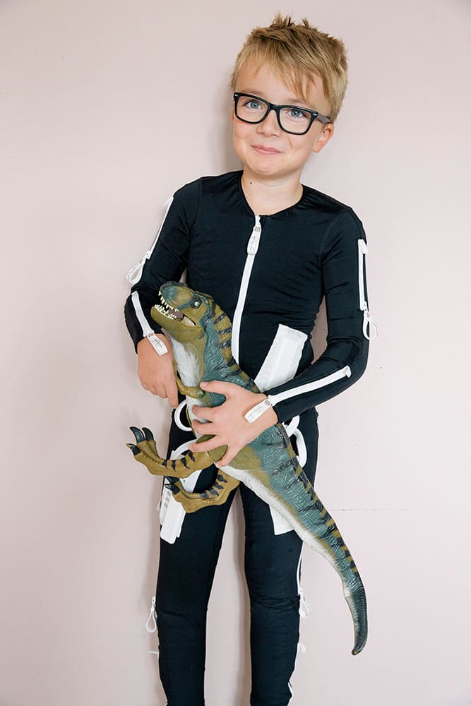 Boy Carrying a Toy Dinosaur — Wearable Technology - Mollii Exopulse