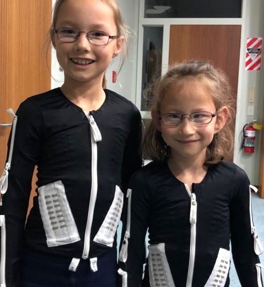 Children Wearing Mollii Suit — Wearable Technology - Mollii Exopulse