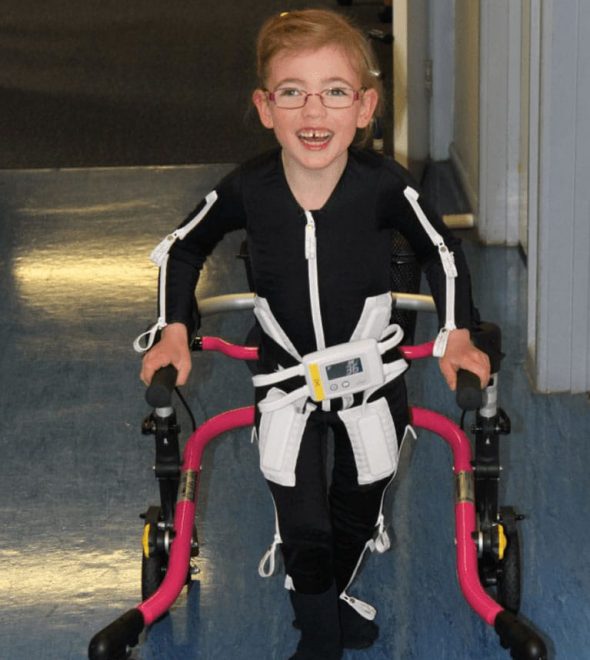 Happy Kid Walking And Using Mollii Suit — Wearable Technology - Mollii Exopulse