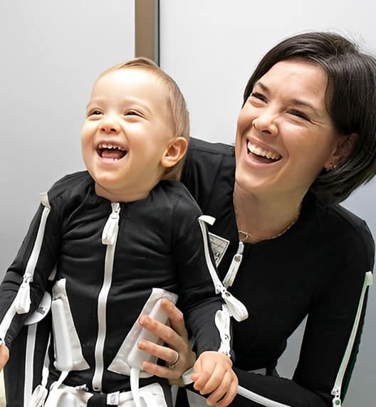 Mom And Child Laughing — Wearable Technology - Mollii Exopulse